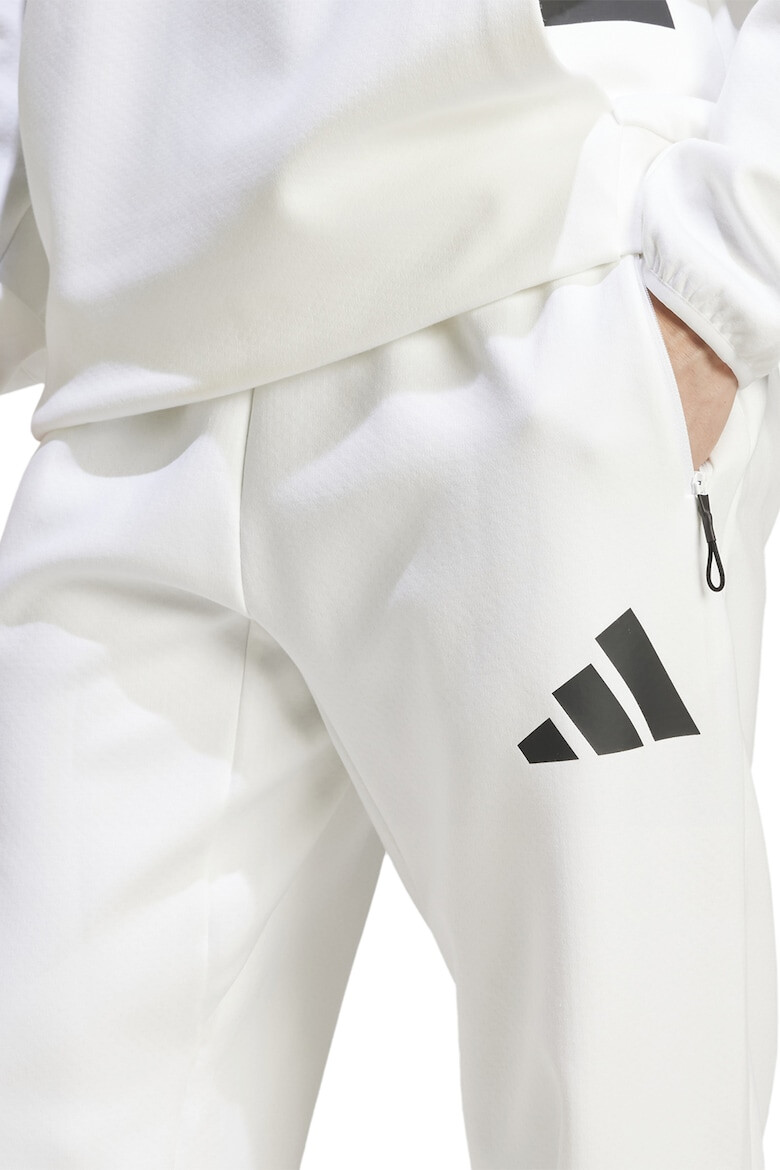 adidas Sportswear Pantaloni de trening cu buzunare cu fermoar Z.N.E. - Pled.ro