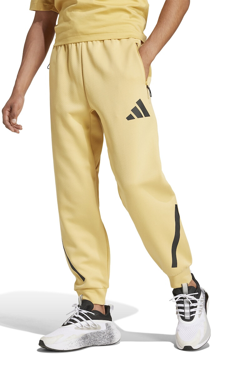 adidas Sportswear Pantaloni de trening cu buzunare cu fermoar Z.N.E. - Pled.ro