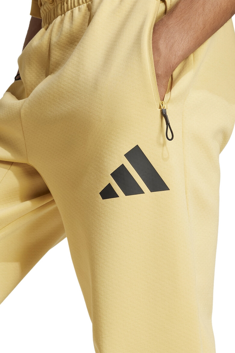 adidas Sportswear Pantaloni de trening cu buzunare cu fermoar Z.N.E. - Pled.ro