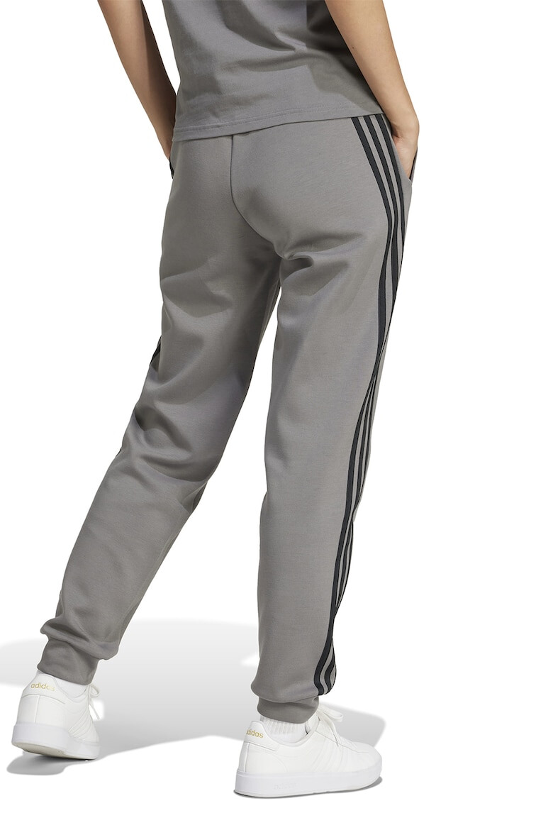 adidas Sportswear Pantaloni de trening cu buzunare laterale - Pled.ro