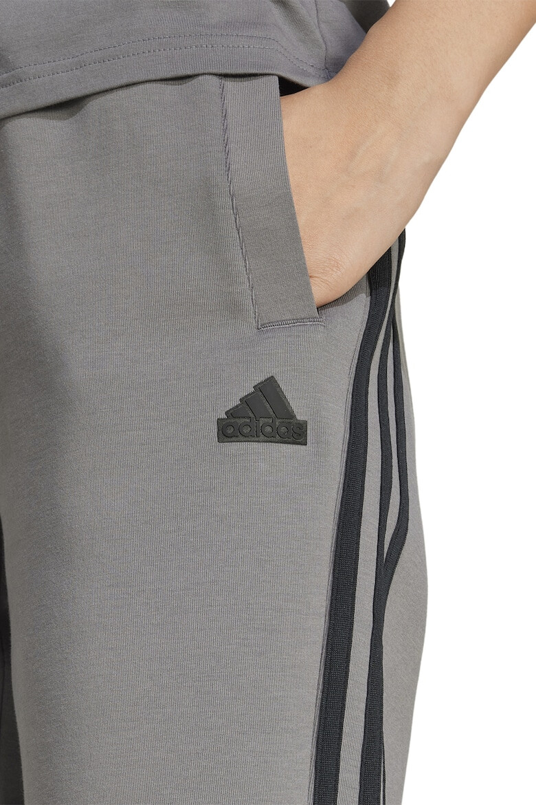 adidas Sportswear Pantaloni de trening cu buzunare laterale - Pled.ro