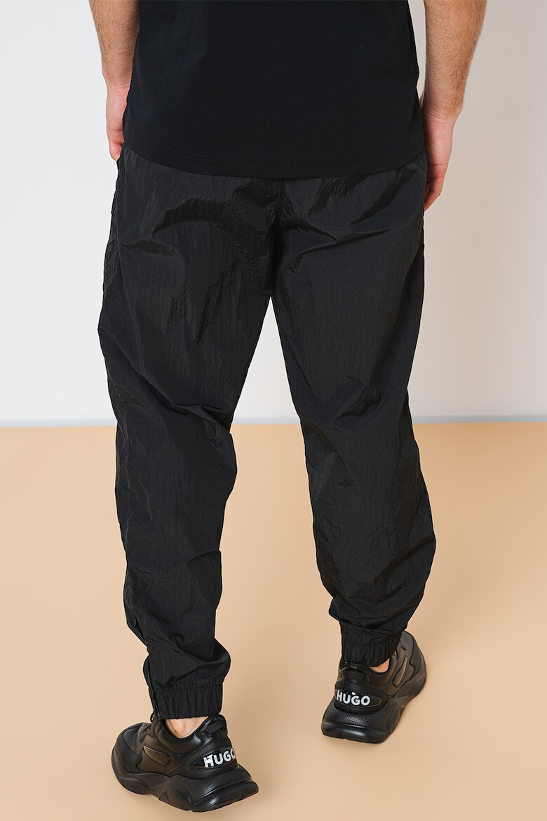 BOSS Pantaloni relaxed fit rezistenti la apa Sracky-2 - Pled.ro