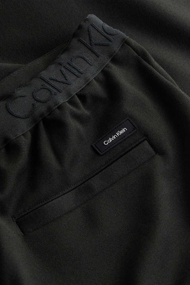 CALVIN KLEIN Pantaloni conici cu buzunare oblice - Pled.ro