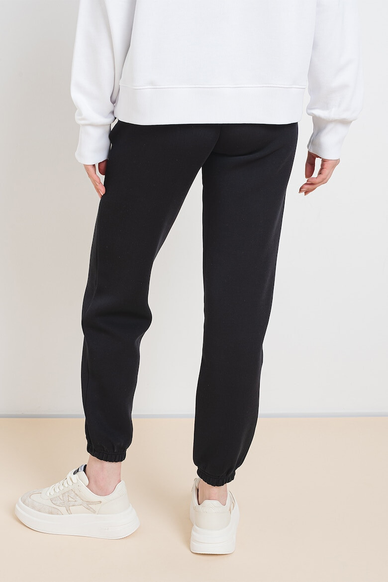 GUESS Pantaloni de trening din amestec de bumbac cu cusaturi frontale - Pled.ro