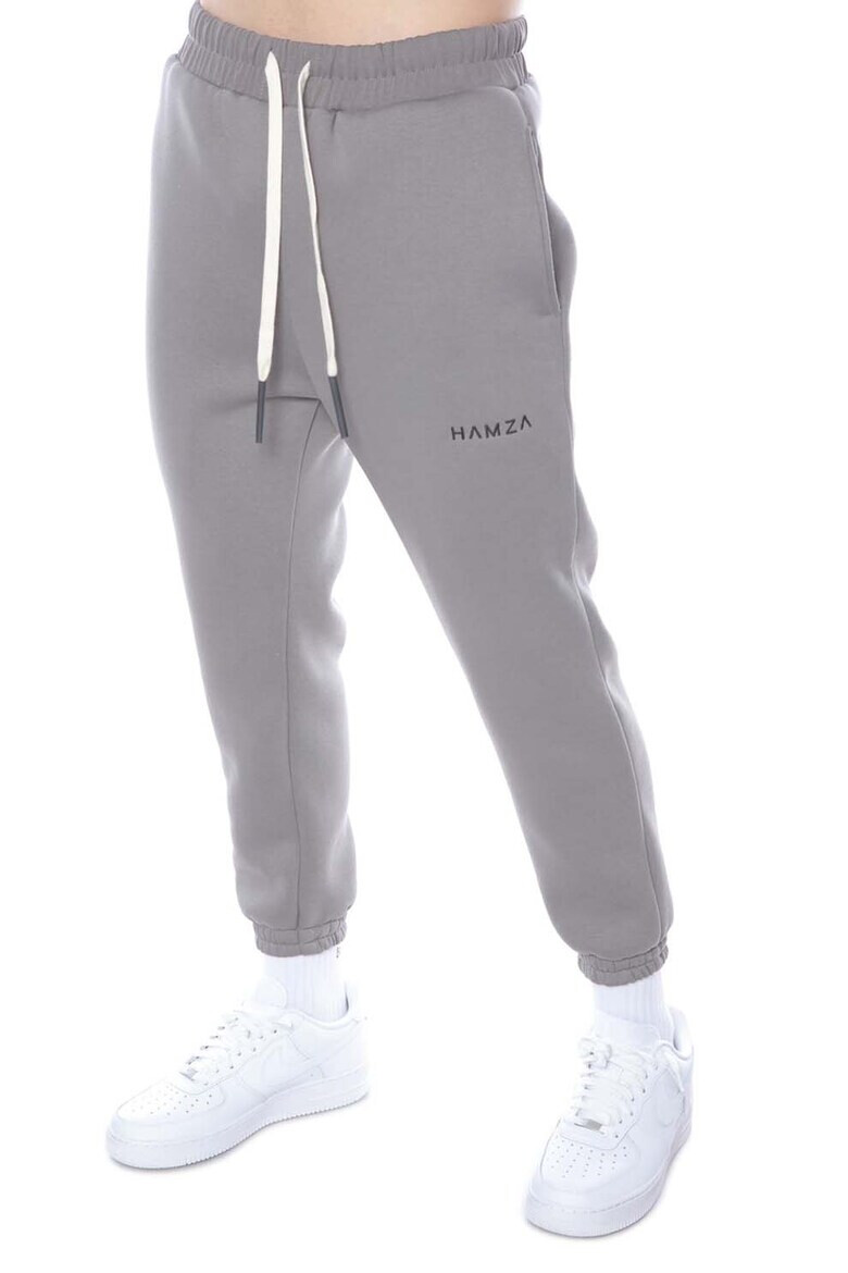 HAMZA Pantaloni sport conici cu buzunare laterale Cement - Pled.ro