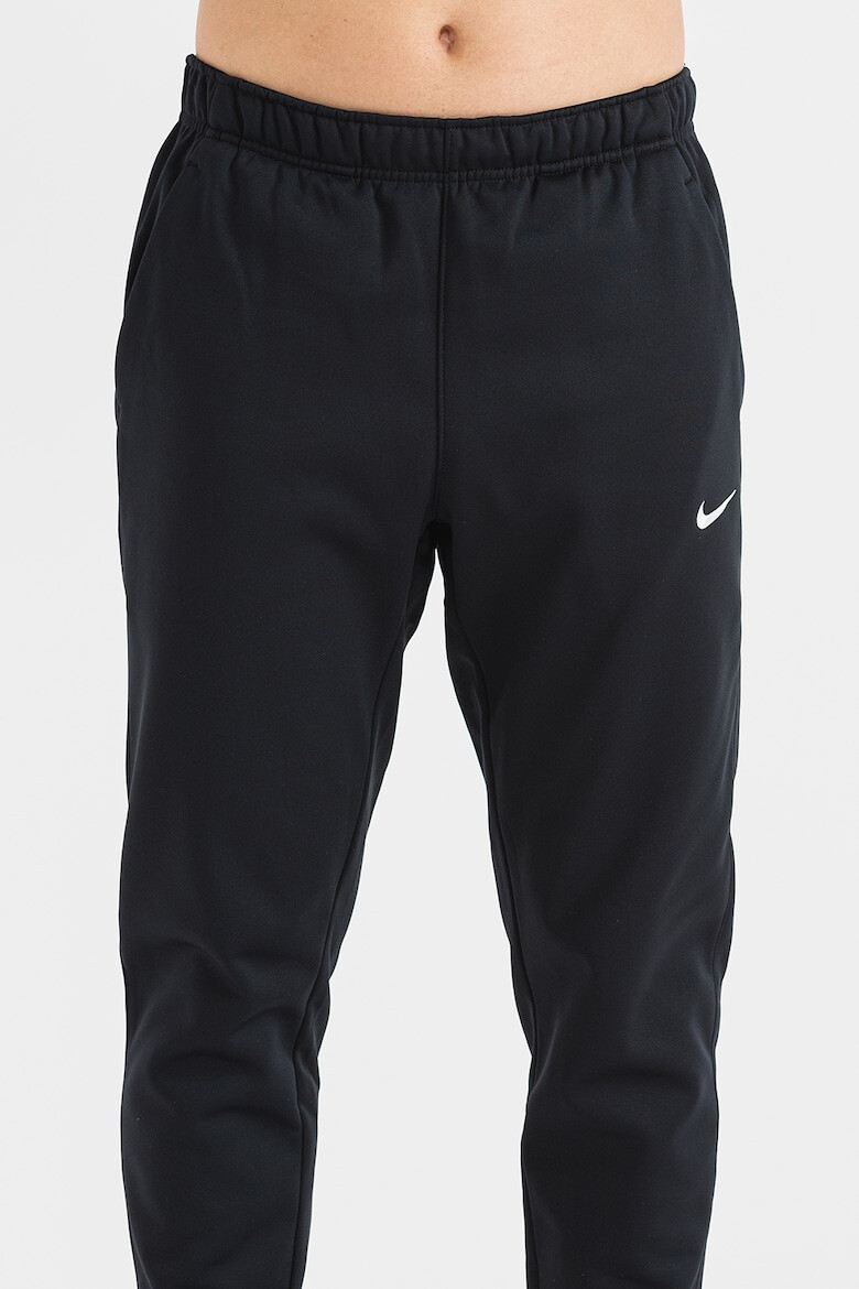 Nike Pantaloni conici cu logo pentru fitness - Pled.ro