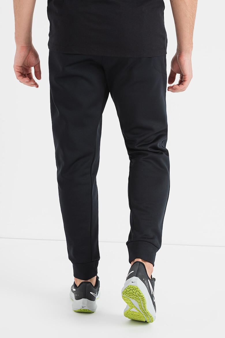 Nike Pantaloni conici cu logo pentru fitness - Pled.ro