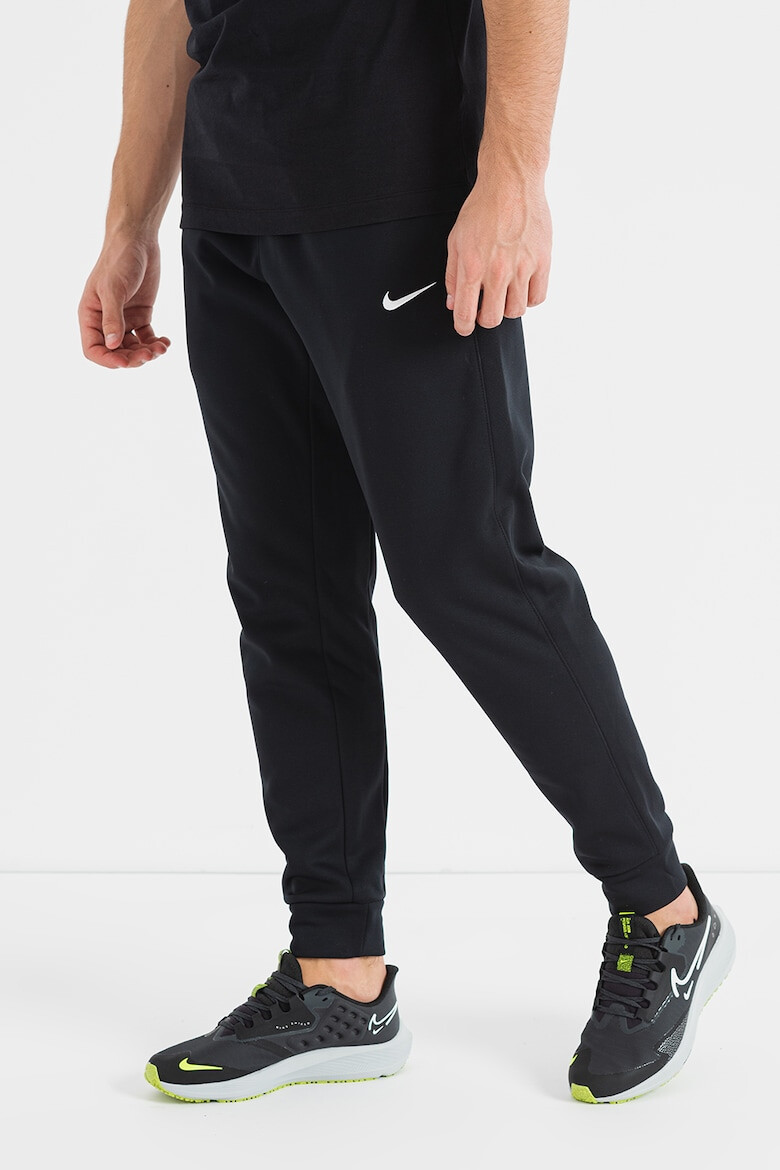 Nike Pantaloni conici cu logo pentru fitness - Pled.ro