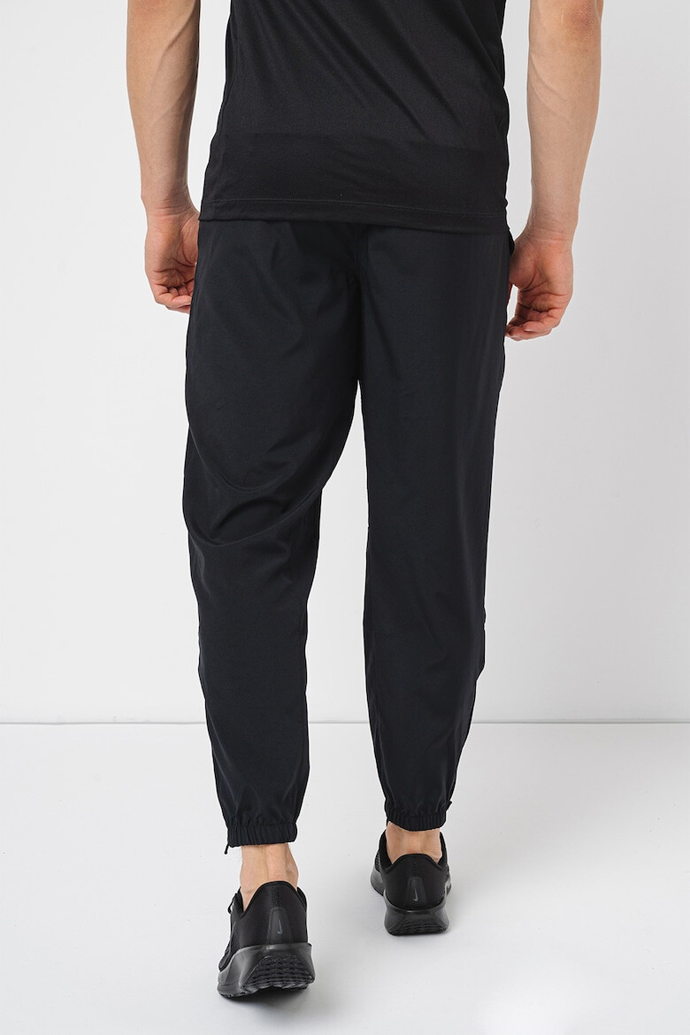 Nike Pantaloni cu tehnologie Dri-Fit imprimeu logo si buzunare oblice pentru fitness - Pled.ro