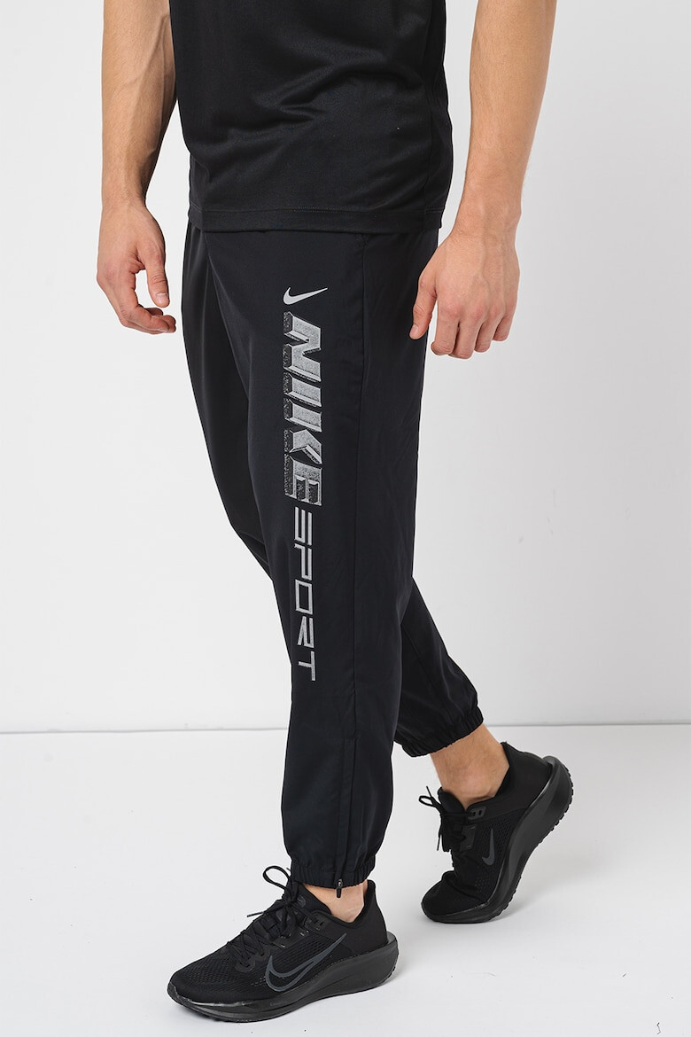 Nike Pantaloni cu tehnologie Dri-Fit imprimeu logo si buzunare oblice pentru fitness - Pled.ro