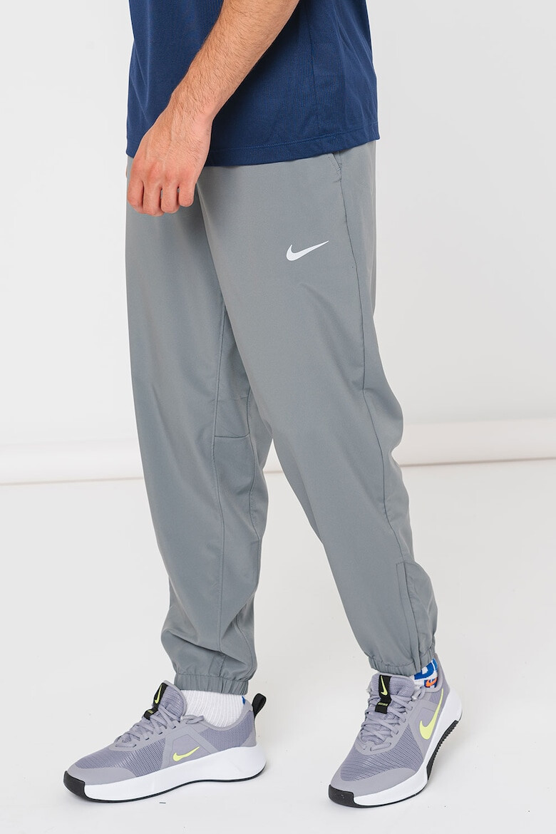 Nike Pantaloni cu tehnologie Dri-Fit pentru fitness - Pled.ro