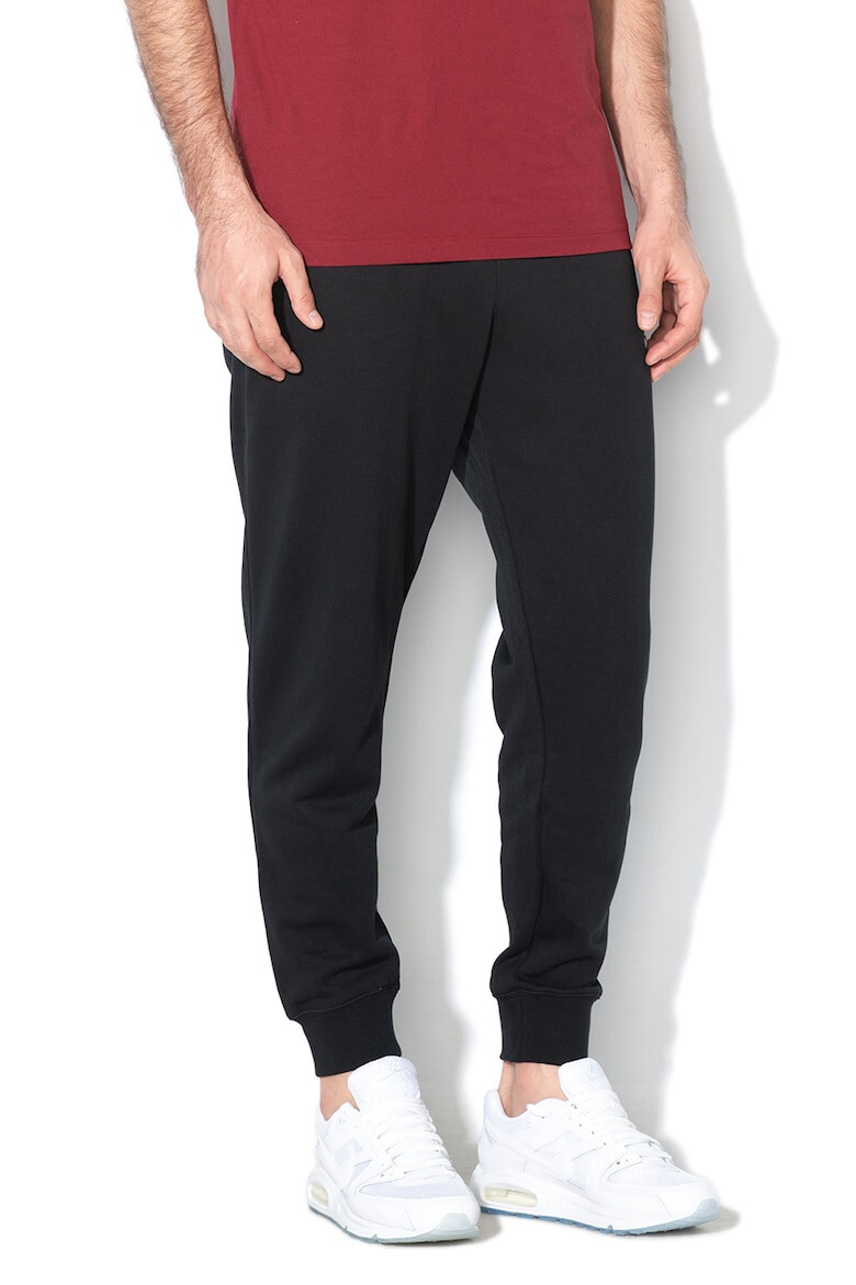 Nike Pantaloni de trening conici cu buzunare laterale Sportswear Club - Pled.ro