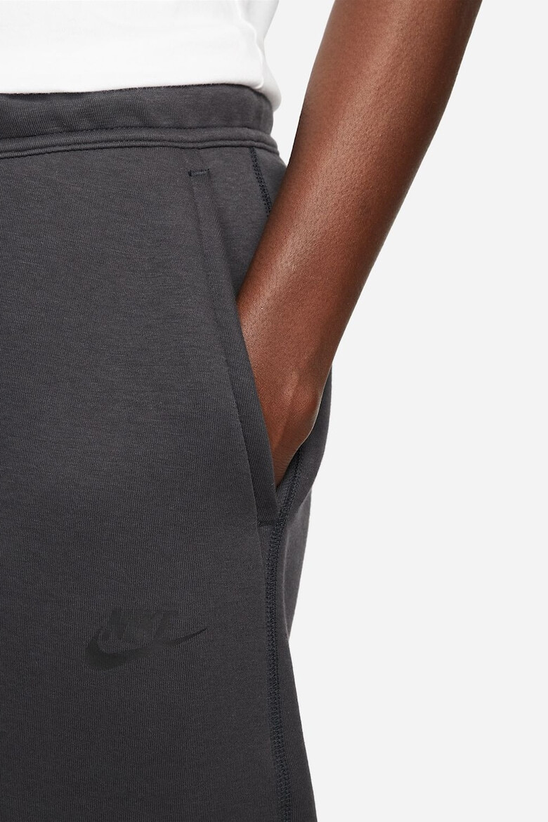 Nike Pantaloni de trening cu buzunare cu fermoar - Pled.ro