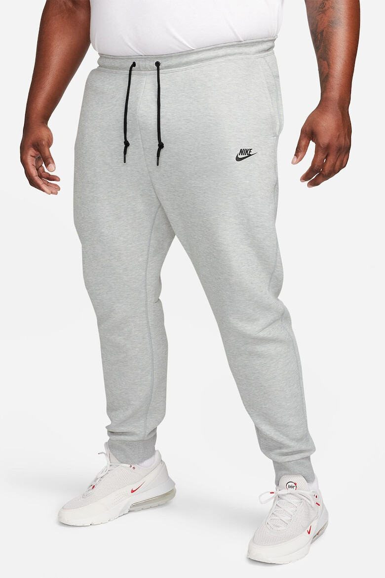 Nike Pantaloni de trening cu buzunare cu fermoar - Pled.ro