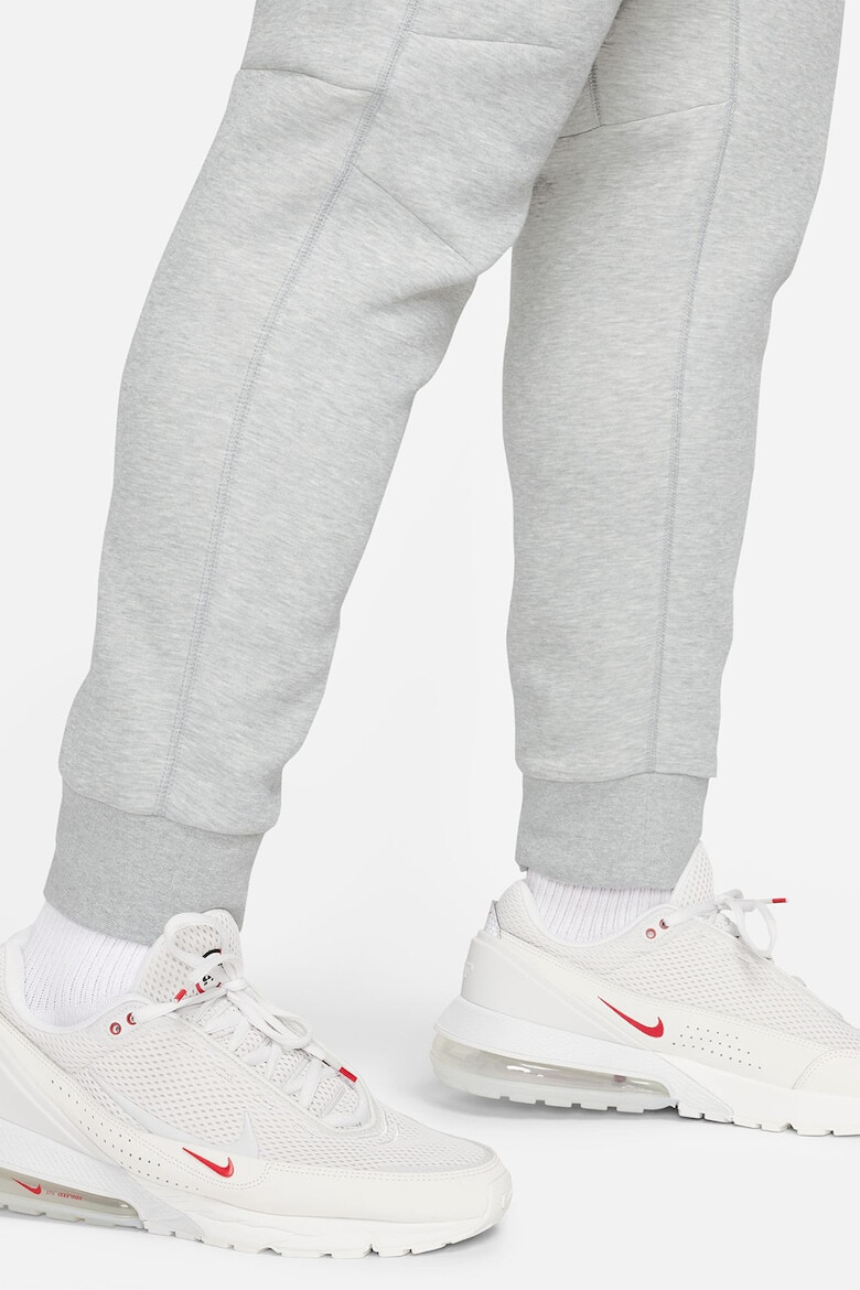 Nike Pantaloni de trening cu buzunare cu fermoar - Pled.ro