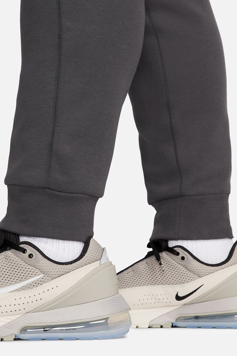 Nike Pantaloni de trening cu buzunare cu fermoar - Pled.ro