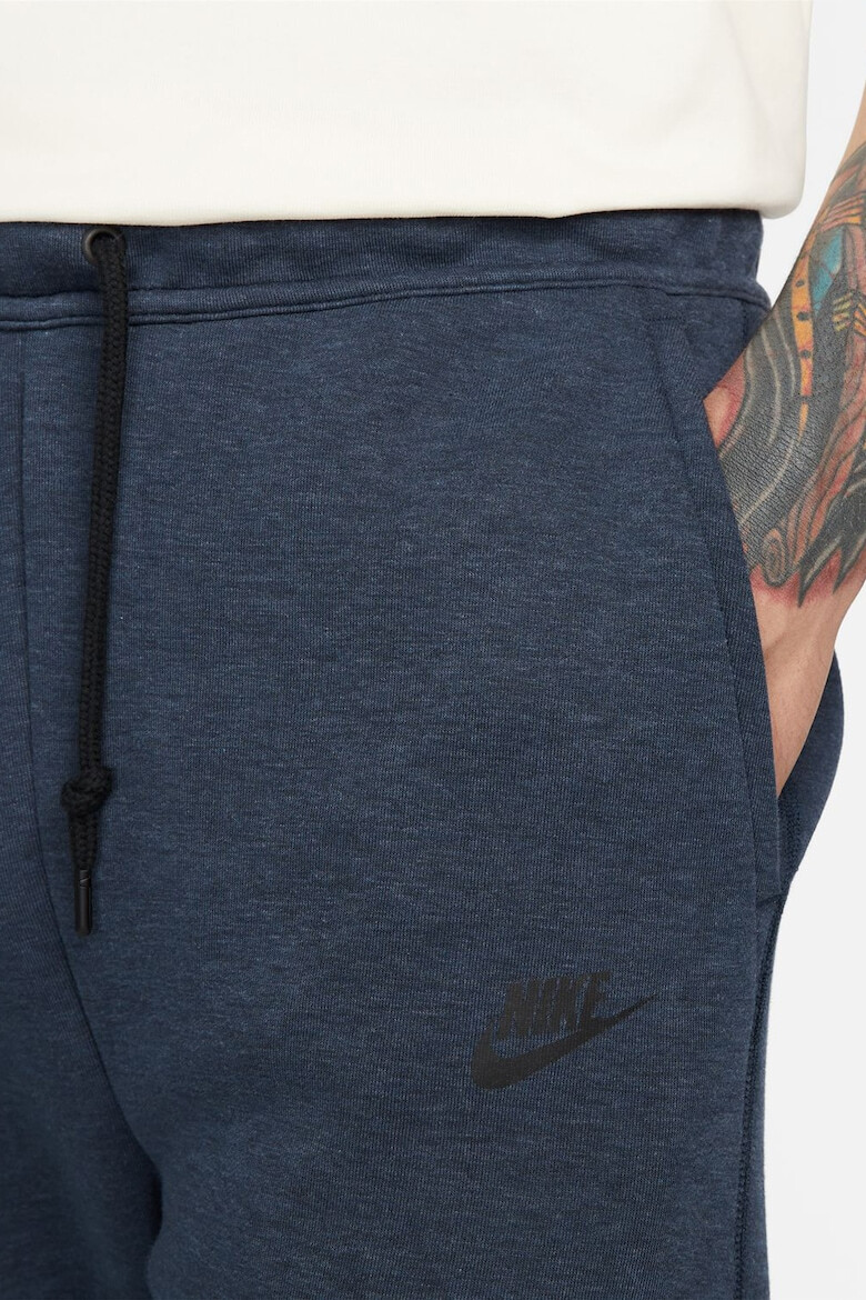 Nike Pantaloni de trening cu buzunare cu fermoar - Pled.ro