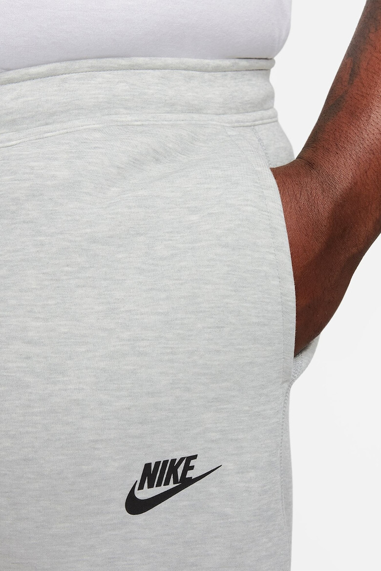 Nike Pantaloni de trening cu buzunare cu fermoar - Pled.ro