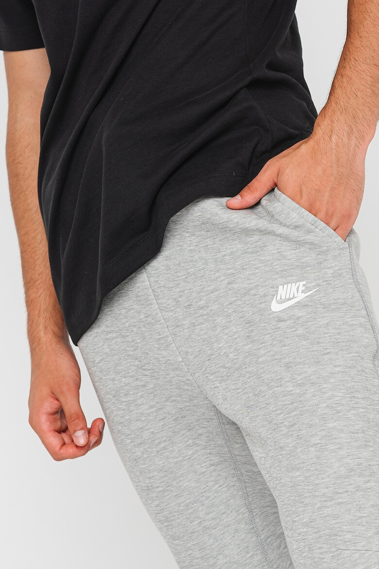 Nike Pantaloni de trening cu buzunare cu fermoar - Pled.ro