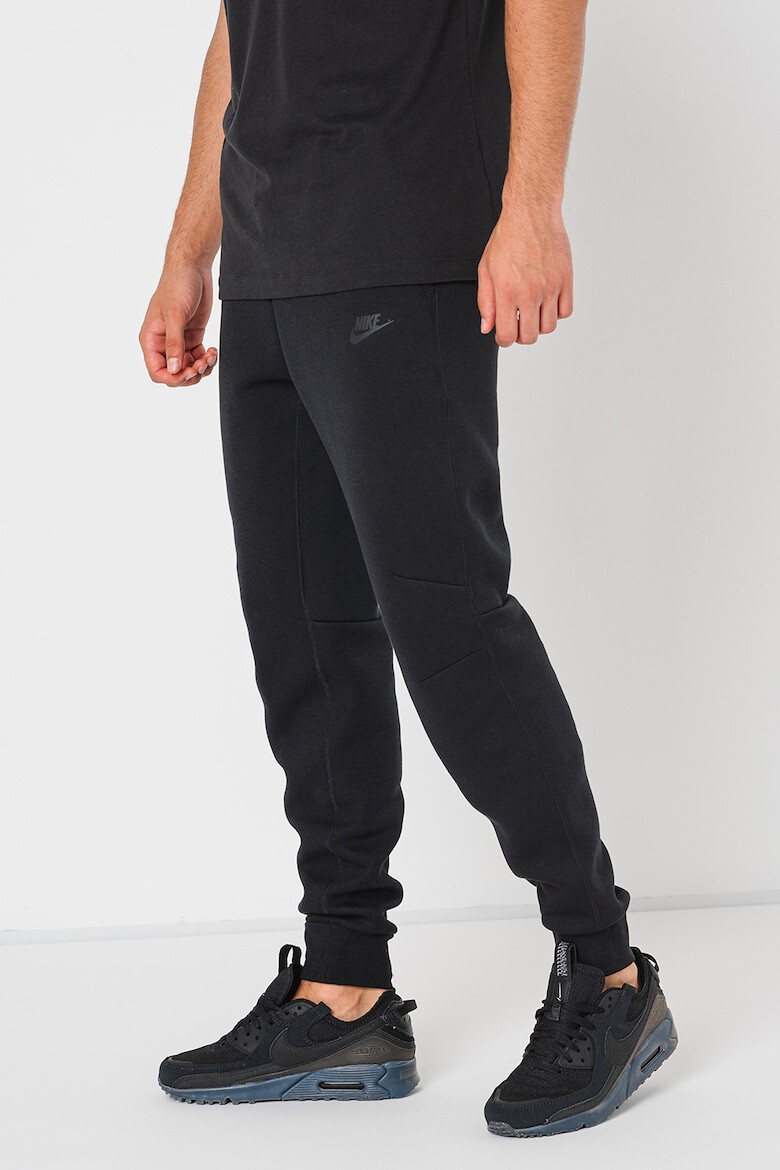 Nike Pantaloni de trening cu buzunare cu fermoar - Pled.ro