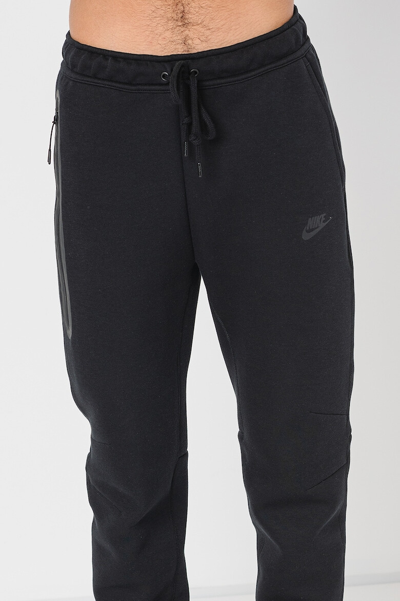 Nike Pantaloni de trening cu buzunare cu fermoar - Pled.ro