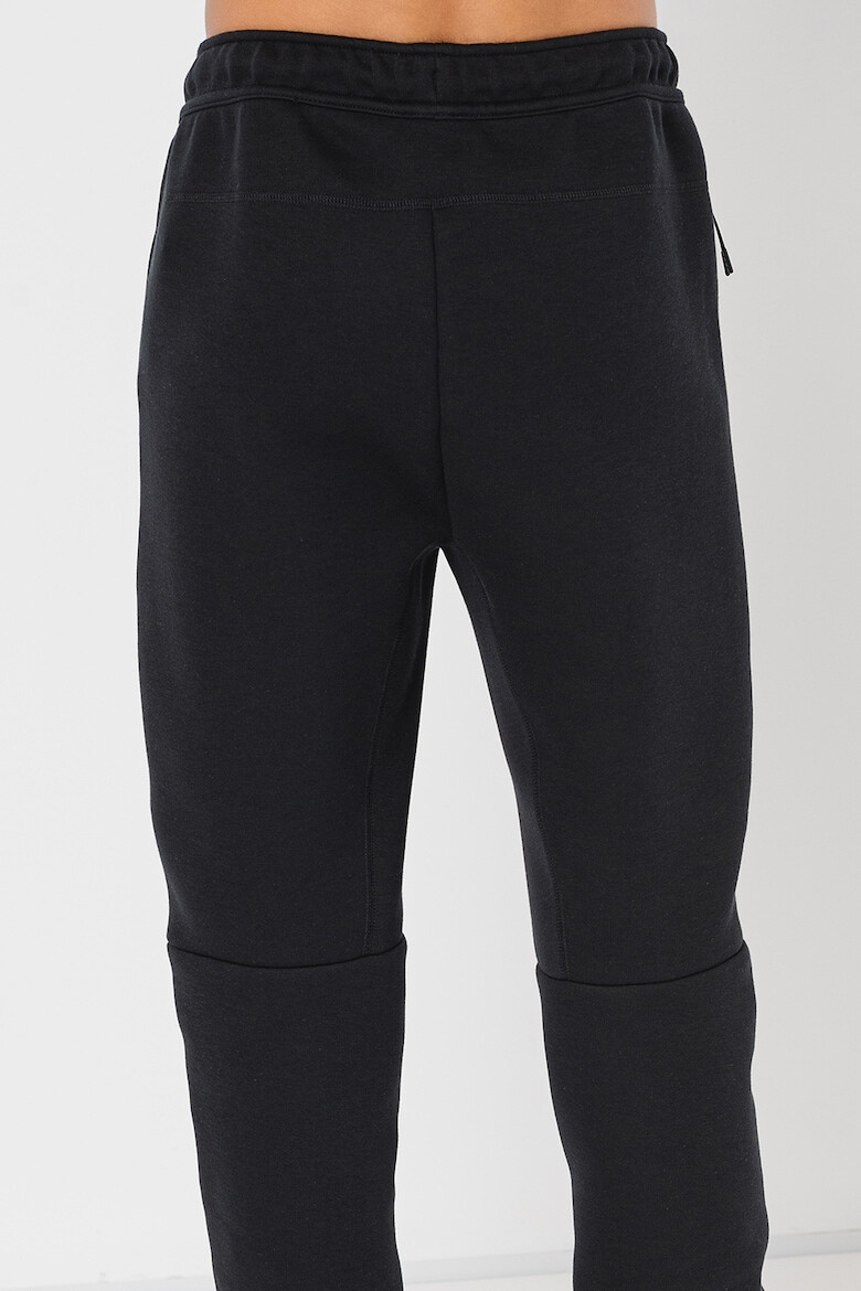 Nike Pantaloni de trening cu buzunare cu fermoar - Pled.ro