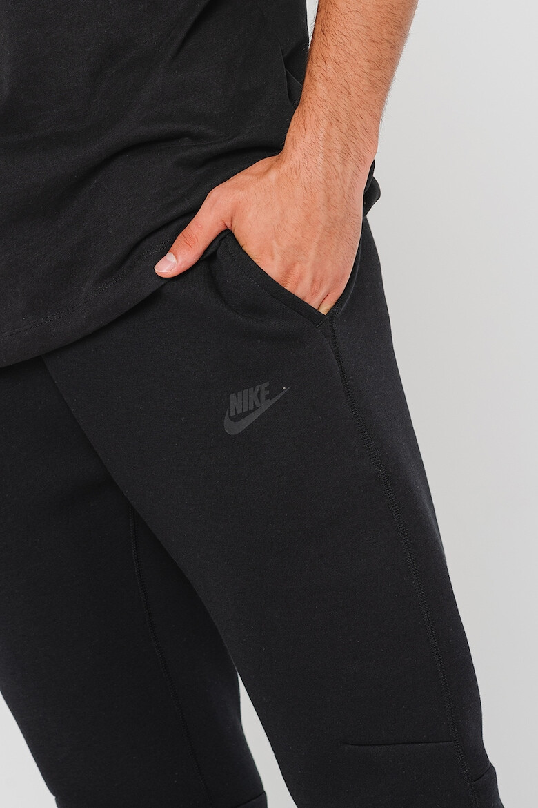 Nike Pantaloni de trening cu buzunare cu fermoar - Pled.ro