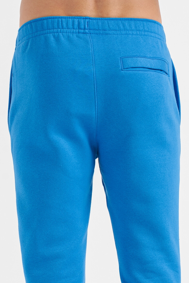 Nike Pantaloni de trening cu buzunare laterale - Pled.ro