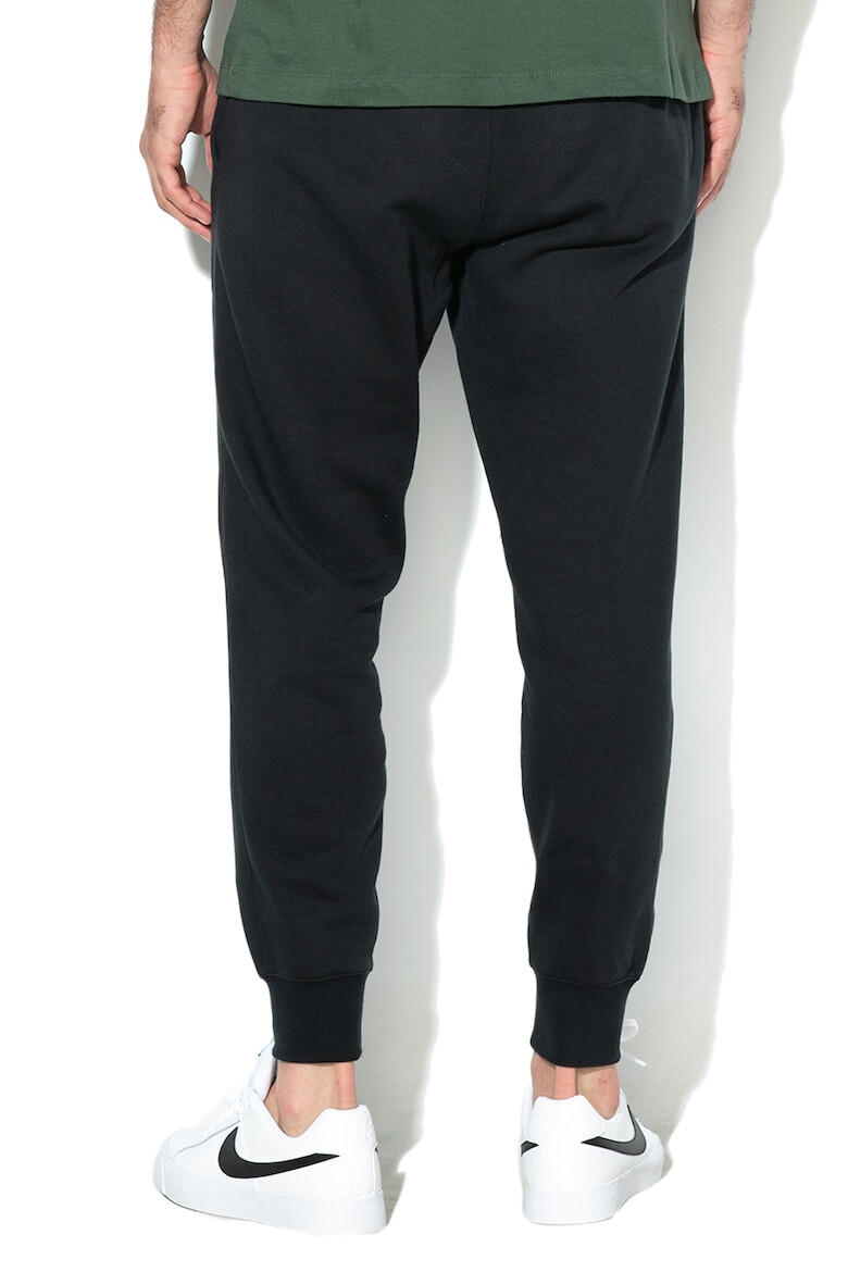 Nike Pantaloni de trening cu buzunare laterale - Pled.ro