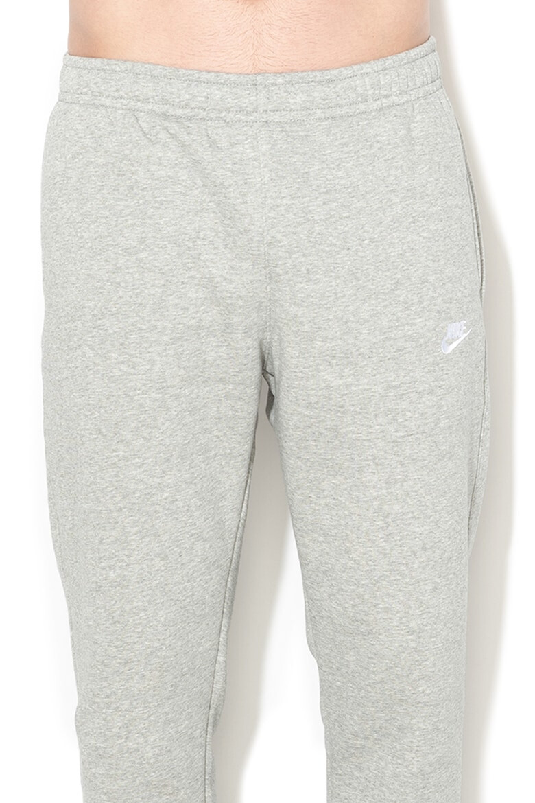 Nike Pantaloni de trening cu buzunare laterale - Pled.ro