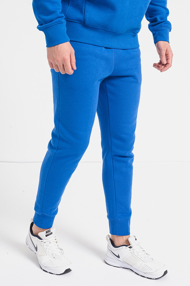 Nike Pantaloni de trening cu buzunare laterale - Pled.ro