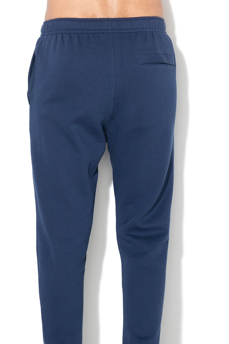 Nike Pantaloni de trening cu buzunare laterale - Pled.ro