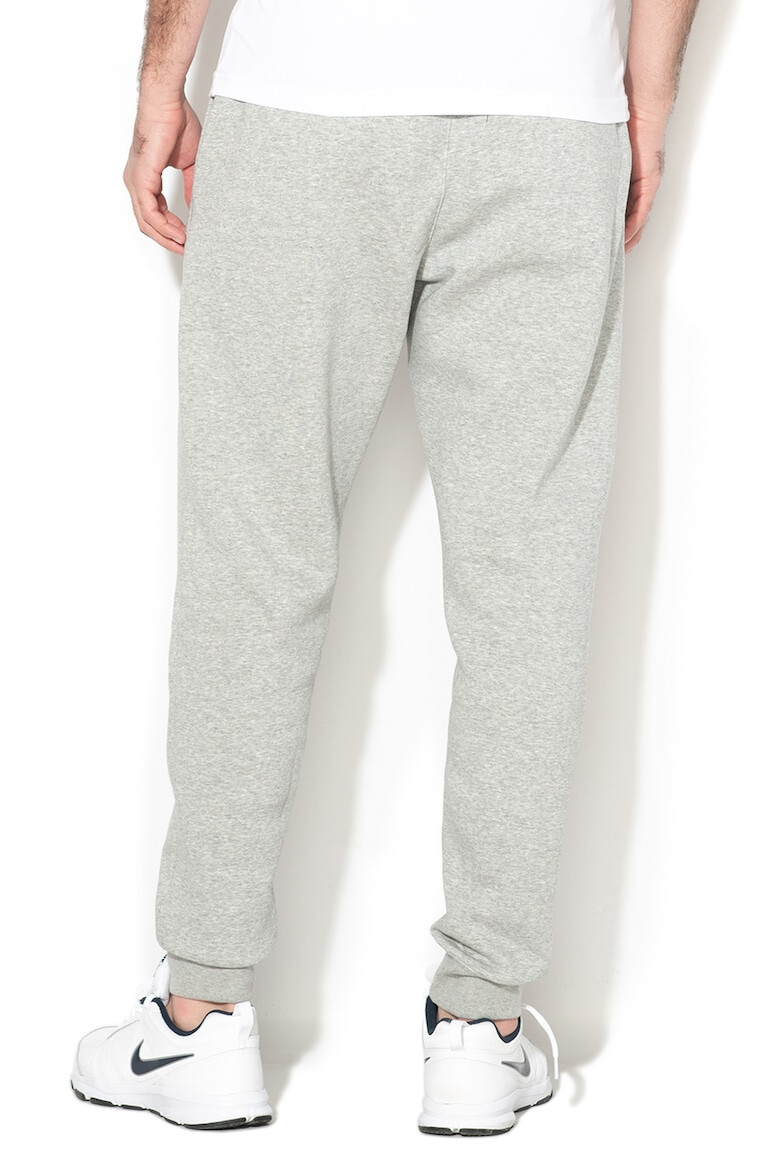 Nike Pantaloni de trening cu buzunare laterale - Pled.ro