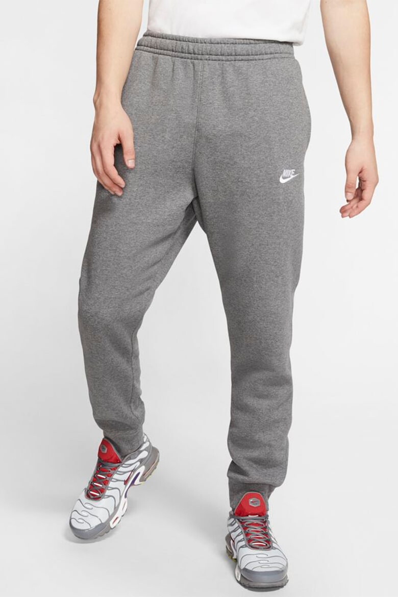 Nike Pantaloni de trening cu buzunare laterale - Pled.ro