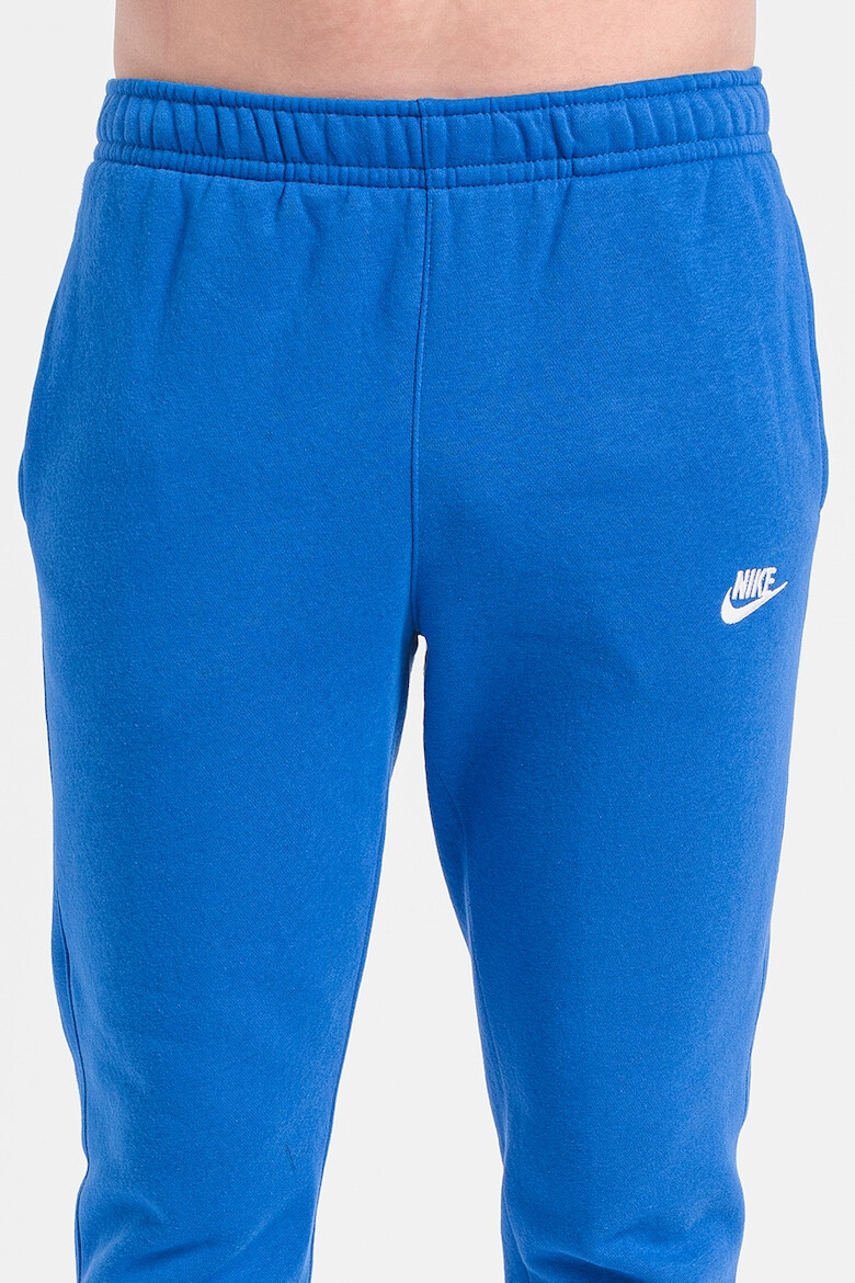 Nike Pantaloni de trening cu buzunare laterale - Pled.ro