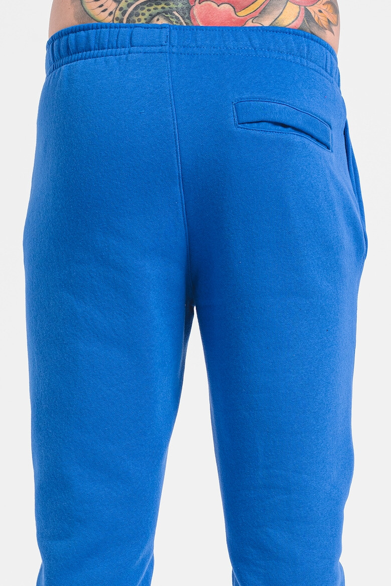 Nike Pantaloni de trening cu buzunare laterale - Pled.ro