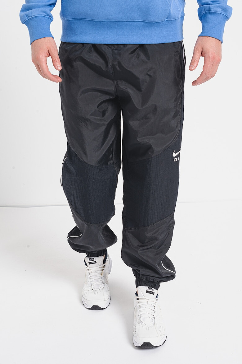 Nike Pantaloni de trening relaxed fit cu buzunare laterale - Pled.ro