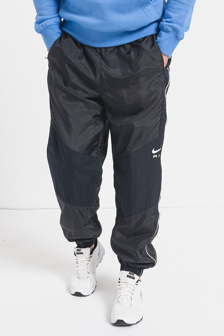 Nike Pantaloni de trening relaxed fit cu buzunare laterale - Pled.ro