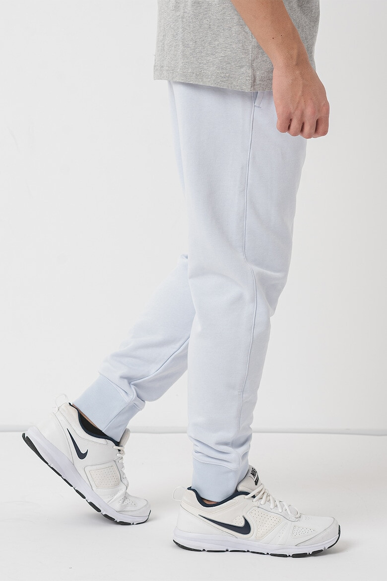 Nike Pantaloni de trening conici cu buzunare laterale Sportswear Club - Pled.ro