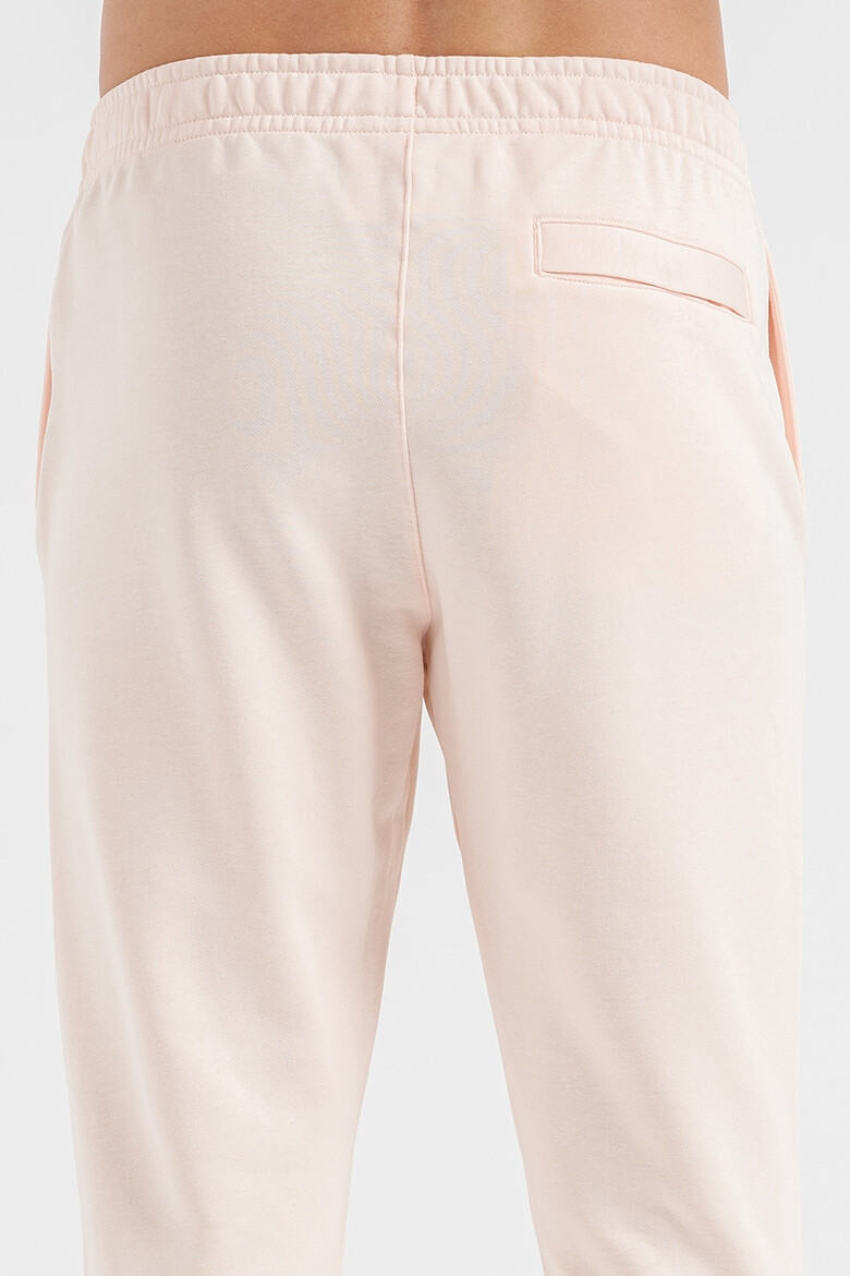 Nike Pantaloni de trening conici cu buzunare laterale Sportswear Club - Pled.ro