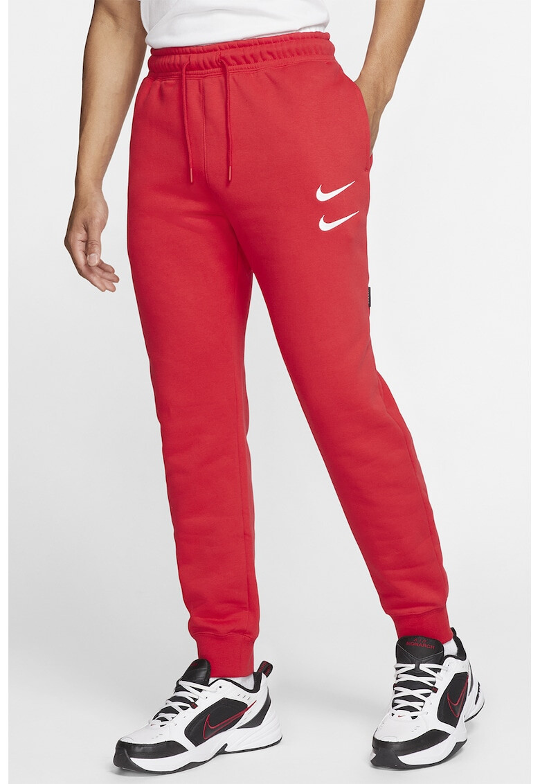 Nike Pantaloni sport conici Swoosh - Pled.ro