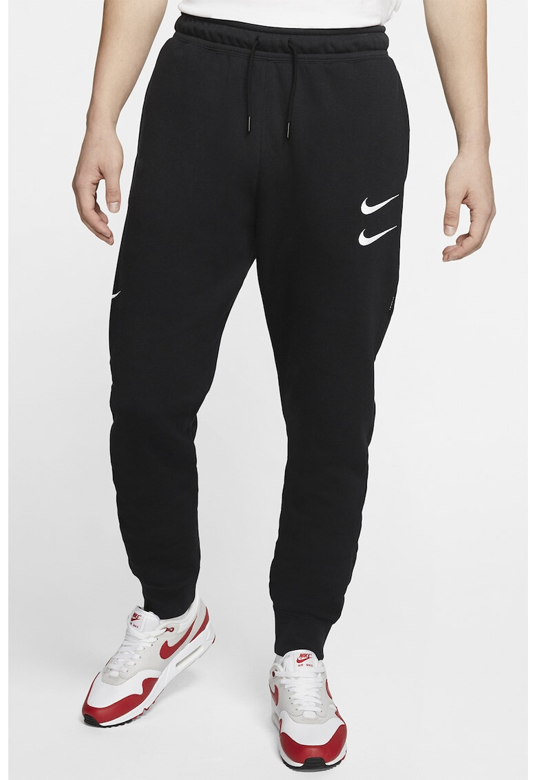 Nike Pantaloni sport conici Swoosh - Pled.ro