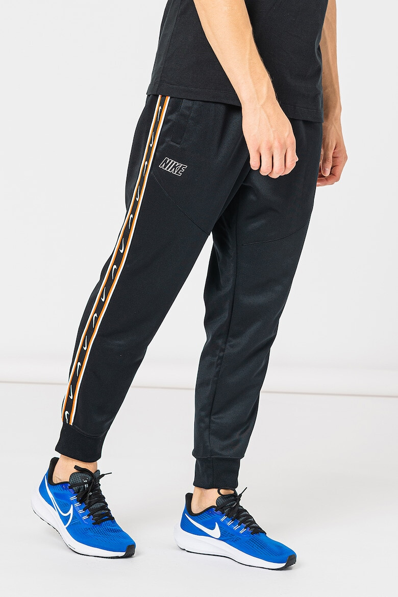 Nike Pantaloni de trening cu logo contrastant Repeat - Pled.ro