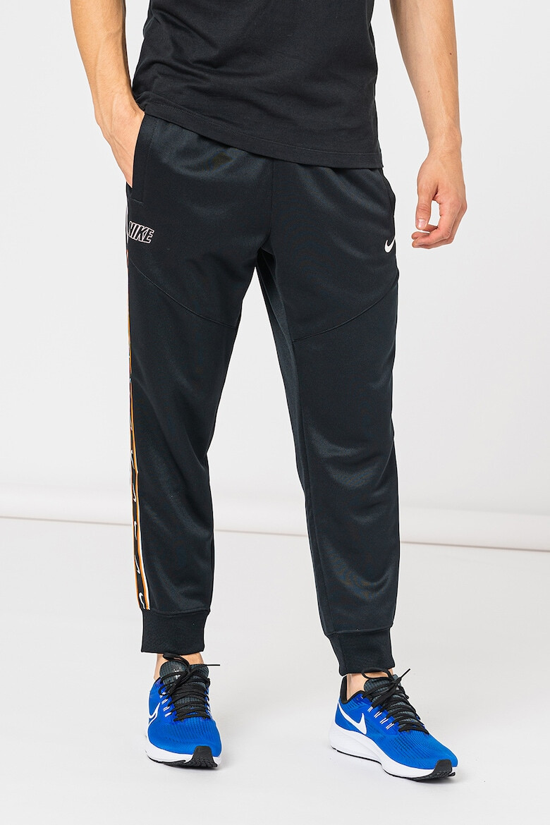 Nike Pantaloni de trening cu logo contrastant Repeat - Pled.ro