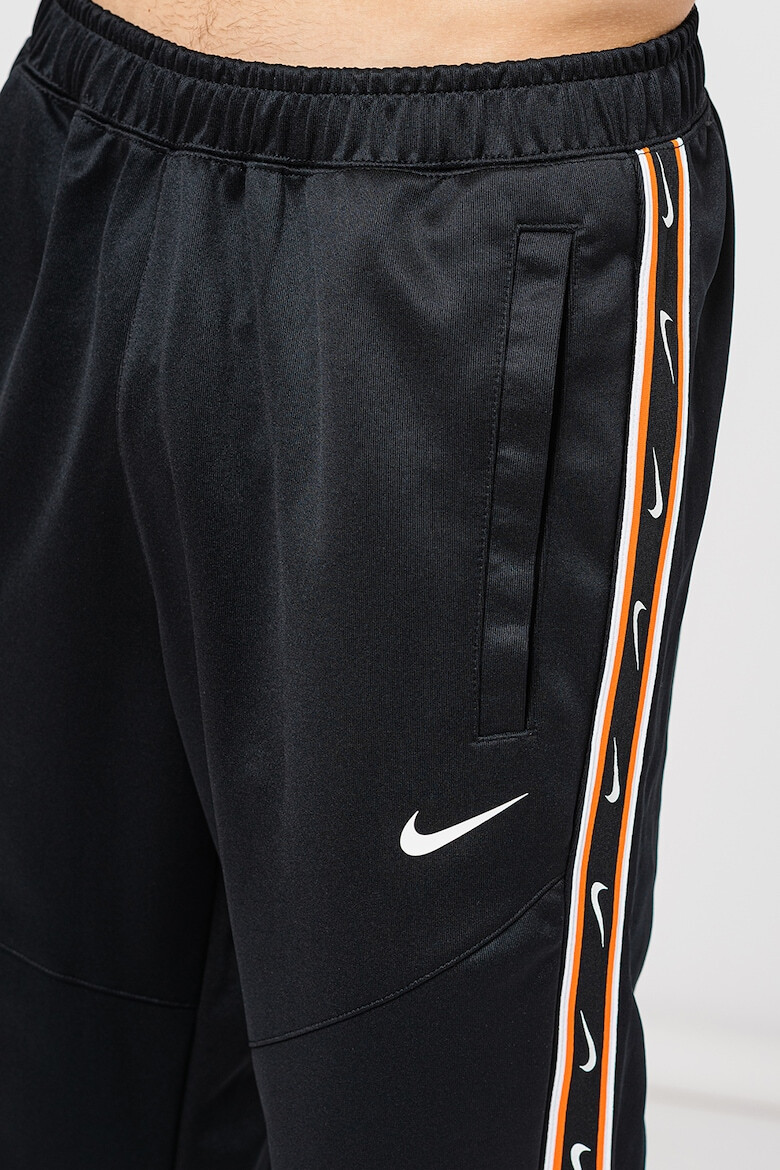 Nike Pantaloni de trening cu logo contrastant Repeat - Pled.ro