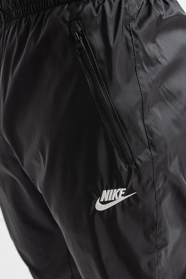 Nike Pantaloni cu slituri cu fermoar la glezna Windrunner - Pled.ro