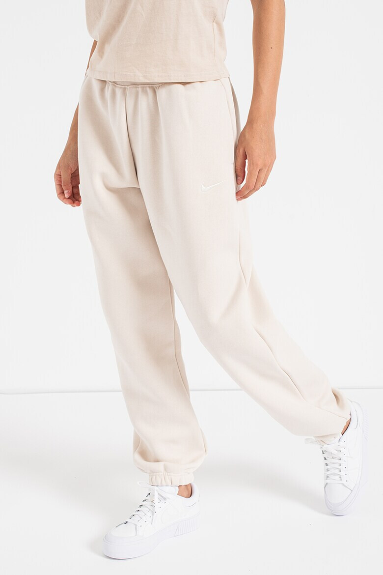 Nike Pantaloni de trening relaxed fit cu logo Phoenix - Pled.ro