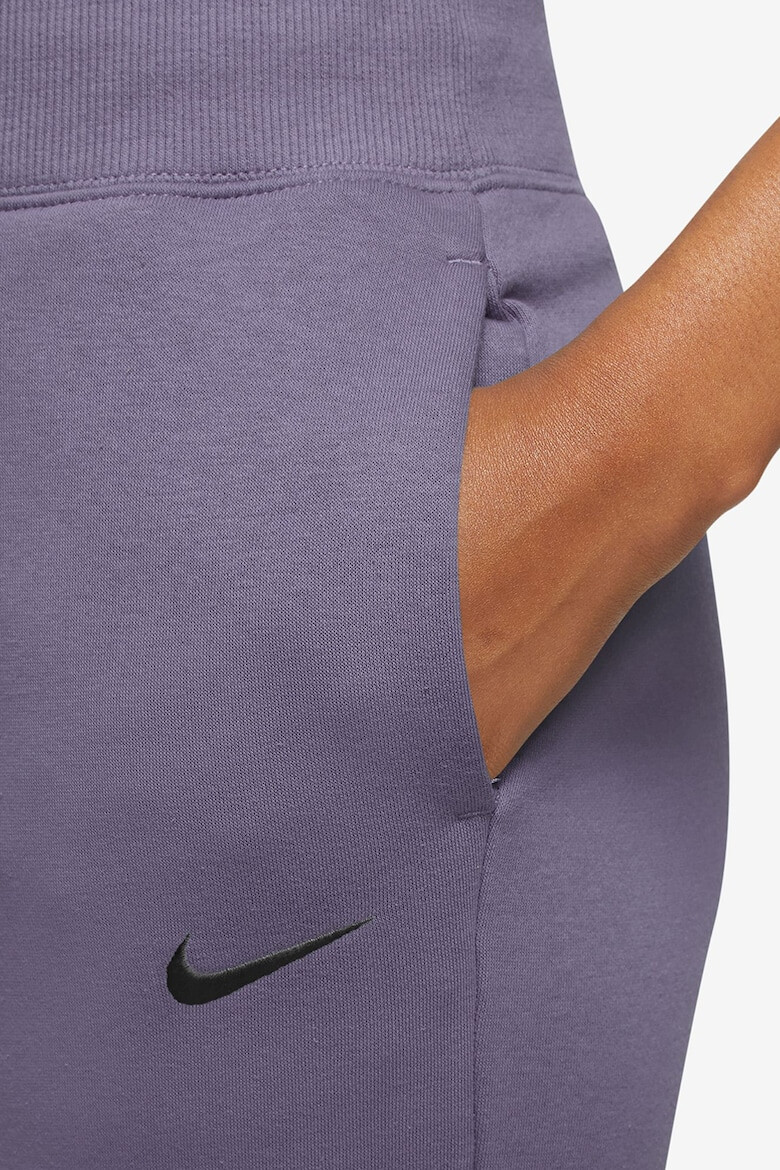 Nike Pantaloni de trening relaxed fit cu logo Phoenix - Pled.ro