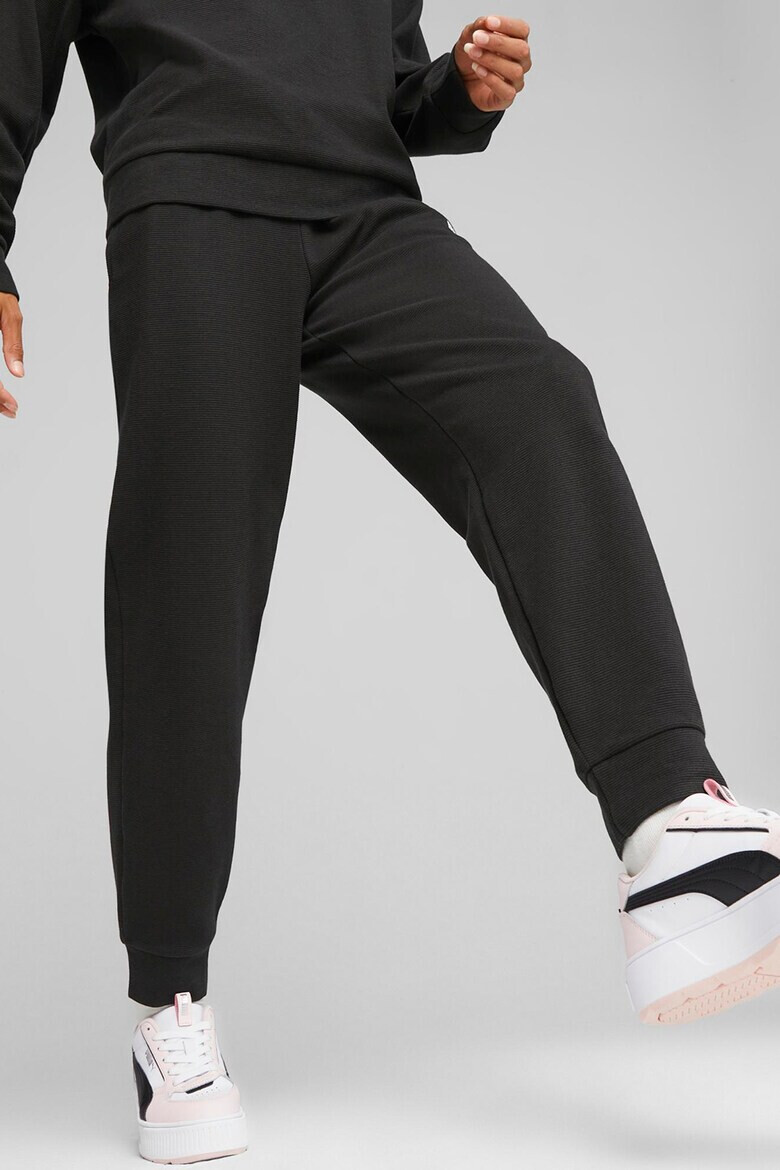 Puma Pantaloni conici de trening cu buzunare laterale Essentials Elavated - Pled.ro