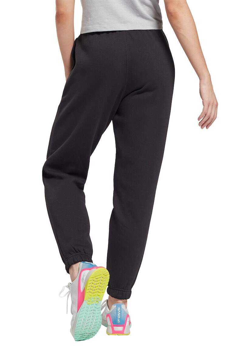 Reebok Pantaloni slim fit cu buzunare laterale pentru fitness - Pled.ro